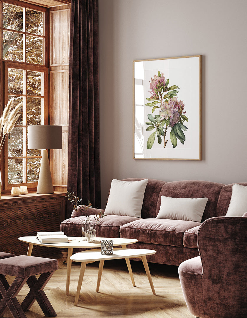 a cozy living room with a large window, a brown sofa, a wooden coffee table, and a framed floral artwork on the wall.