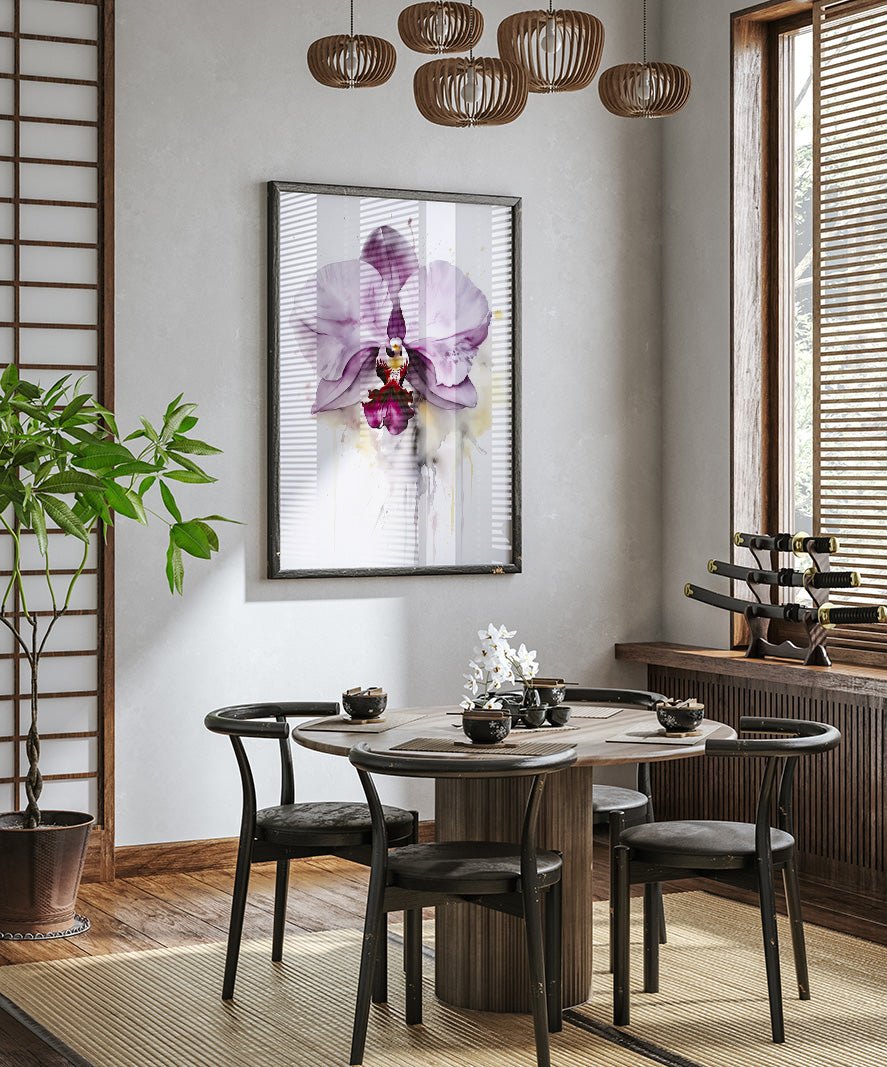 a modern dining room with a round wooden table, four black chairs, and a large window with wooden blinds. A framed picture of a purple orchid is hanging on the wall above the table, and a potted plant is placed on the floor next to the table.