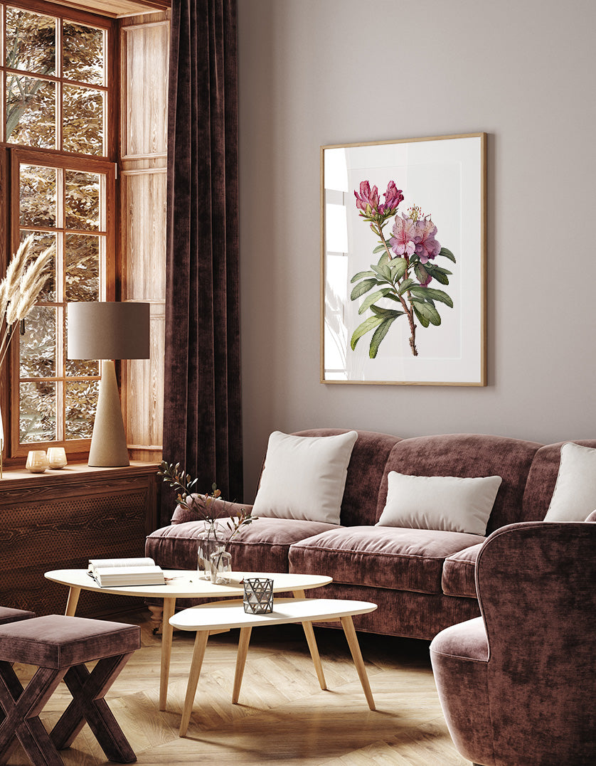 a cozy living room with a large window, a brown sofa, a wooden coffee table, and a framed floral artwork on the wall.