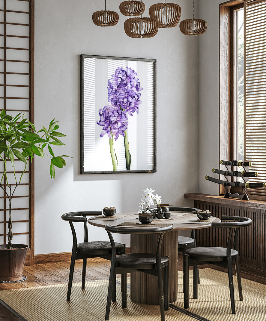 a modern dining room with a wooden table and chairs, a large framed purple flower on the wall, and a potted plant on the floor.