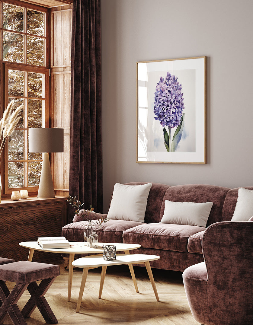 a cozy living room with a large window, a brown sofa, a wooden coffee table, and a framed picture of a purple flower on the wall.