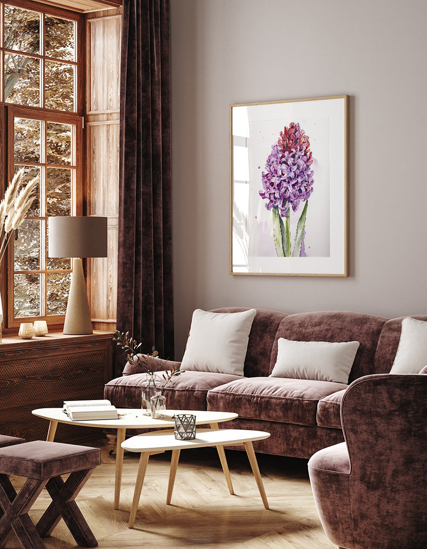 a cozy living room with a large window, a plush couch, a coffee table, and a framed painting of a purple flower on the wall.