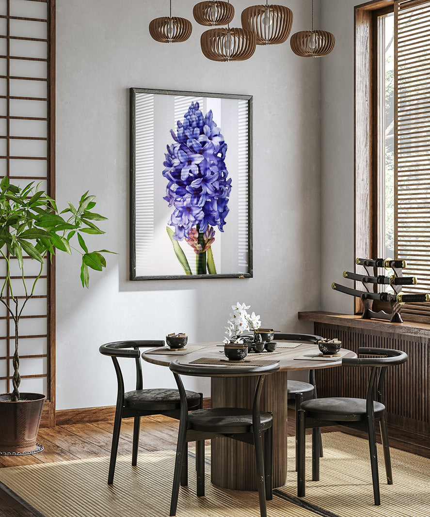 a modern dining room with a wooden table and chairs, a large framed picture of a purple hyacinth flower hanging on the wall, and a potted plant on the left side of the room.