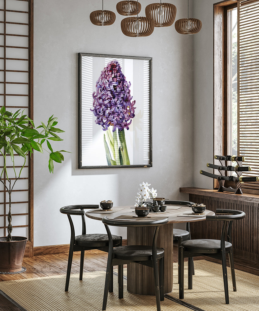 a modern dining room with a round wooden table, four black chairs, and a large framed picture of a purple flower hanging on the wall above the table.